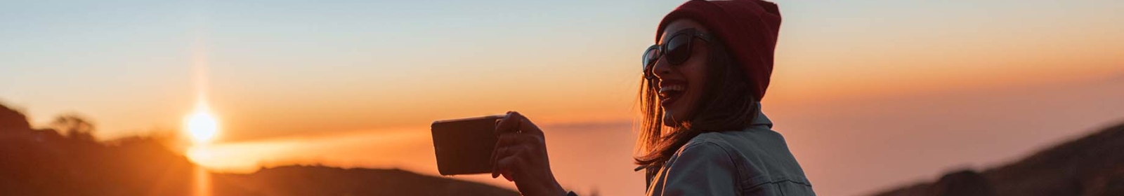 a woman taking a selfie in the evening