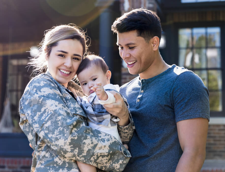 Young couple holding a baby