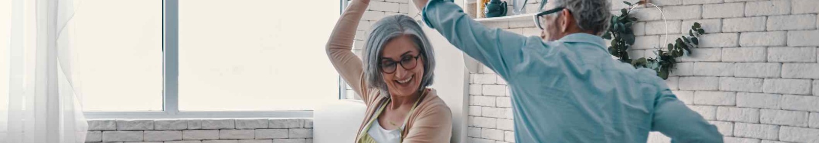 a couple dancing in a kitchen